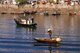 China: Hakka man and ferry boats, Waisha Harbour, Beihai, Guangxi Province